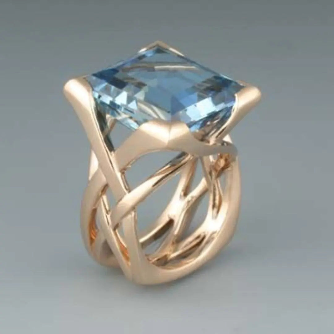Rose gold antique inspired ring with blue zircon