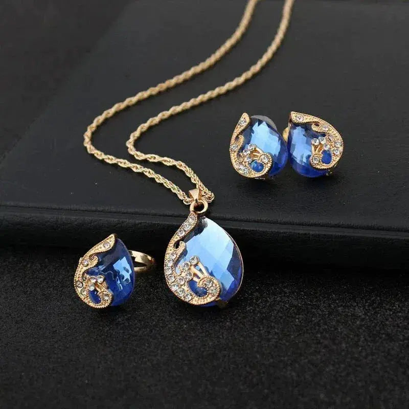 Gouden blauwe kristallen ketting en oorbellen set