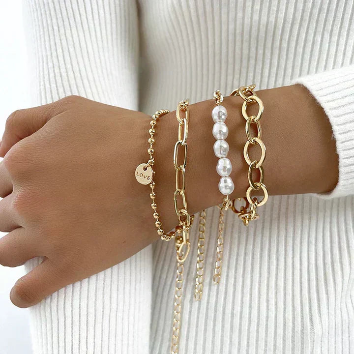 Charming set of gold bracelets with pearls